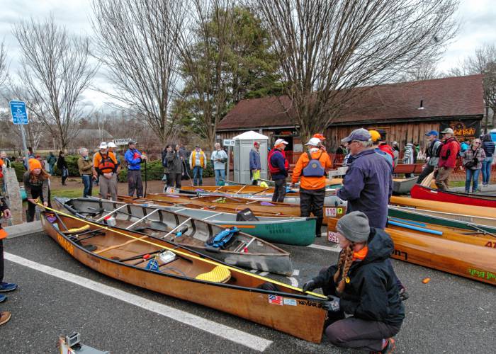 The winning boats are checked for length at the finish in Orange on Saturday after the 59th running of the River Rat Race. 