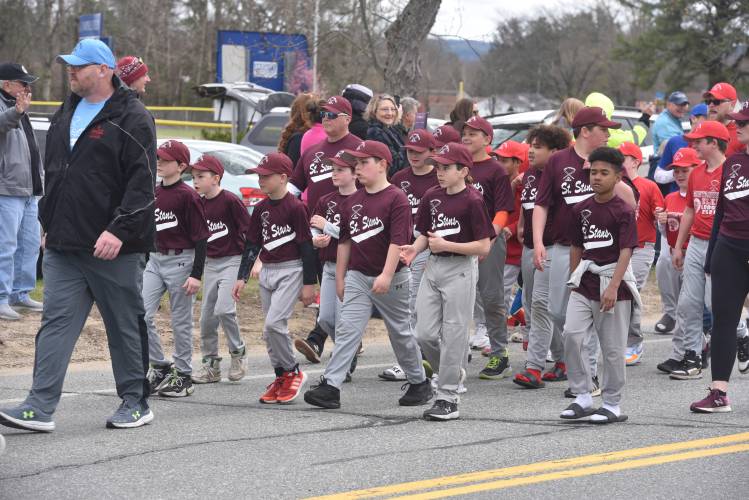 Newt Guilbault players make their way to the Newt Guilbault Fields during Sunday’s Opening Day parade. 