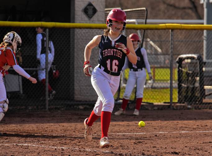 Frontier’s Adelaide Ehle (16) runs to first base after making contact against Agawam during the Redhawks’ season opener on Friday at Zabek Field in South Deerfield.