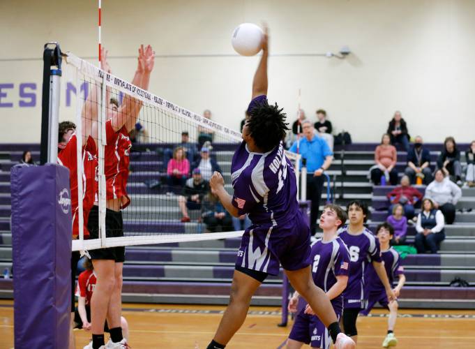 Holyoke’s Gedeon Ortiz-Torres (15) registers a kill against Athol in the first set Friday in Holyoke.