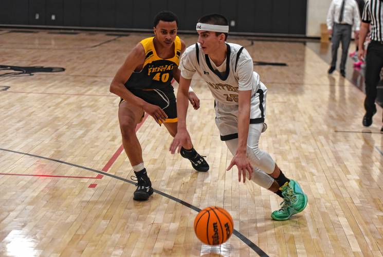 Pioneer’s Alex McClelland (15) drives to the past during the Panthers’ 65-37 win over Fenway in the MIAA Division 5 Round of 32 on Friday night at Messer Gymnasium in Northfield.