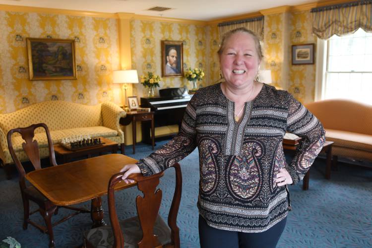 Innkeeper Laurie McDonald, pictured inside the Deerfield Inn in Old Deerfield, says the number of rooms available in the area could easily increase. “There is so much demand coming out this way,” she says. “I could have 500 rooms, and they would still sell out in May.”