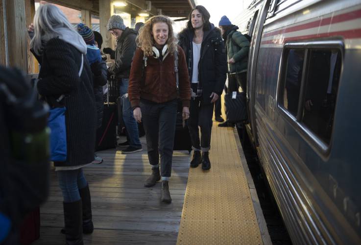Passengers get off an Amtrak train in Northampton last December. Gov. Maura Healey has appointed Andrew Koziol, a UMass Amherst graduate, as the first  West-East Rail director within the Department of Transportation’s Rail & Transit Division. 