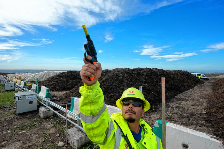 A Republic Services operator shoots a blank into the air to keep wild birds off trash as compost mounds are being cured at the Otay Landfill in Chula Vista, Calif., on Jan. 26. The Otay facility is one strategy to keep organic waste out of landfills.
