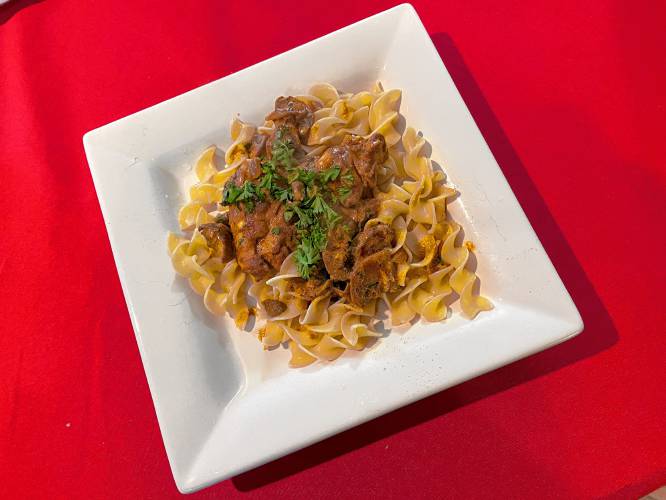 Chicken Paprika served over noodles.