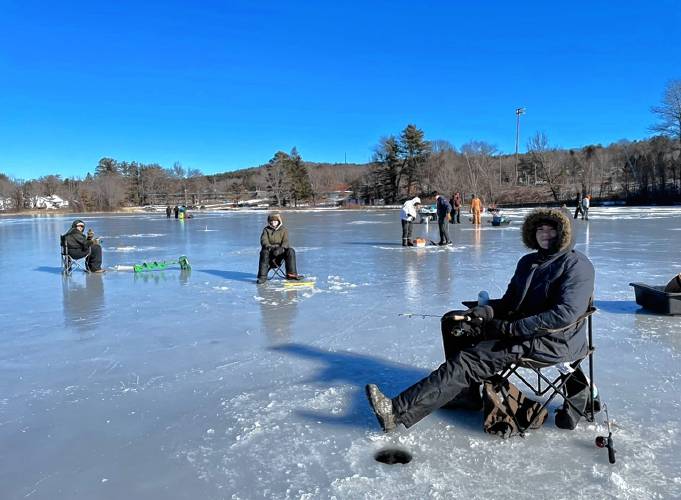 Club members enjoy a day of ice fishing at the Mahar Fish'N Game Club’s Ice Fishing Derby at Lake Ellis in Athol.