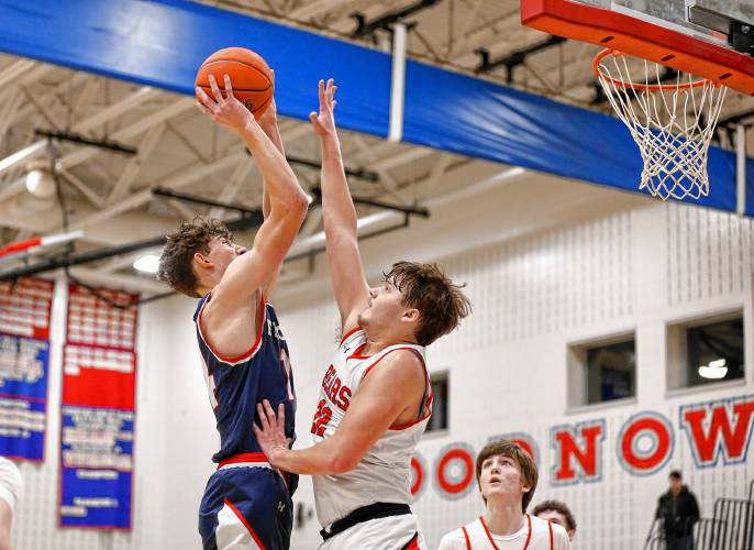 Athol’s Ray Castine (22), right, tries to block a shot from Frontier’s Owen Babb (14) earlier this season at Goodnow Gymnasium in South Deerfield.