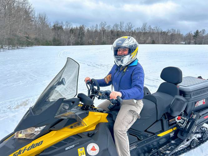 Intrepid reporter Bella Levavi riding a snowmobile.