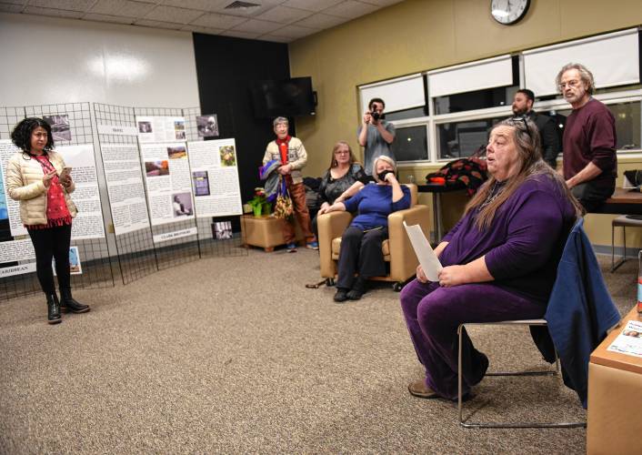 Lindy Whiton, right, a co-director of the indiVISIBLE project, discusses the new touring exhibit “indiVISIBLE: Seeing and Celebrating Indispensable Agricultural Workers” at Greenfield Community College.